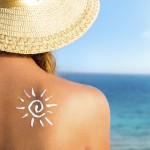 Sun protection, girl using sunscreen to safe her skin healthy